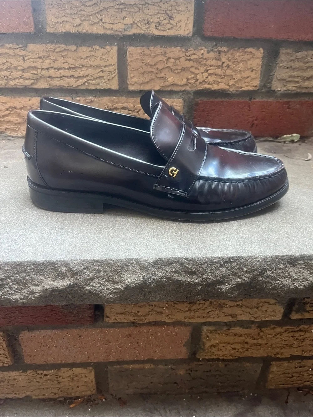 Cole Haan Women's Black Leather Penny Loafers with Gold Accents